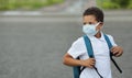 Black School child wearing face mask for coronavirus and flu prevention. Back to school in mask Royalty Free Stock Photo