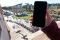 Black screen of a smartphone at he Colosseum in Rome Royalty Free Stock Photo