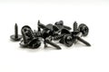 Several black tapping screws in a group on Royalty Free Stock Photo