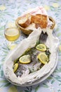 Black sea bream wrapped in paper and baked, Italian cuisine