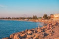 Black Sea coast. Vacationers are photographed against the background of the sea on the coastline at sunset