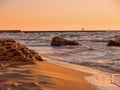 Black Sea landscape with a view of the surf in the rays of golden light. Royalty Free Stock Photo