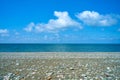 Black sea pebble beach. Sea view on a sunny day Royalty Free Stock Photo