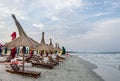 The Black Sea shore, sea side with sand, umbrellas, sun beds and water