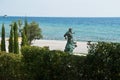 Black sea shore with statue Royalty Free Stock Photo