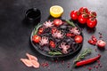 Black seafood pasta with shrimp, octopus and mussels on black background. Mediterranean gourmet food Royalty Free Stock Photo