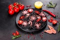 Black seafood pasta with shrimp, octopus and mussels on black background. Mediterranean gourmet food Royalty Free Stock Photo