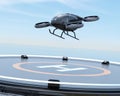 Black self-driving passenger drone takeoff from helipad