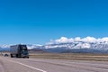 Black semi truck on the freeway Royalty Free Stock Photo