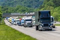 Black Semi Truck In Heavy Interstate Traffic