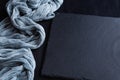 Black serving board and gray gauze tablecloth on a black background Royalty Free Stock Photo