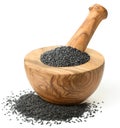 Black sesame seeds in the wooden mortar, isolated on white Royalty Free Stock Photo