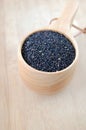 Black sesames in a wooden cup Royalty Free Stock Photo