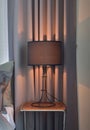 Black shade reading lamp next to bed Royalty Free Stock Photo