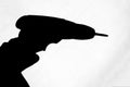 black shadow of a hand holding a drill Royalty Free Stock Photo
