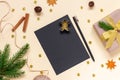 Black sheet of paper for Christmas greetings among natural decorations
