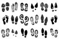 Black shoe footprints. Silhouette boot prints. Human steps traces. Sneakers sole imprints. Foot stamps. Grunge texture