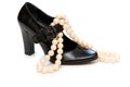 Black shoe and pearl necklace Royalty Free Stock Photo