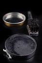 Black shoe polish, brush and shoes on the table. Accessories for cleaning leather footwear Royalty Free Stock Photo