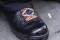 Black shoe with rainbow shoe laces