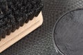 Black shoe shine wax and boot brush. Protecting and impregnate leather shoes