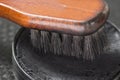 Black shoe shine wax and boot brush. Protecting and impregnate leather shoes Royalty Free Stock Photo