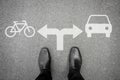 Black shoes at the crossroad - bicycle or car Royalty Free Stock Photo