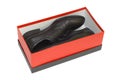 Black shoes in red box on white background Royalty Free Stock Photo