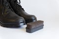 Black shoes and Shoe sponge on white background. Shoe care with a Shoe sponge. Shoe sponge. No people