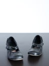 Black shoes on wooden surface Royalty Free Stock Photo