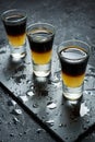 Black Shooter - Black Balsam and peach juice. Hard alcoholic shots on stone table