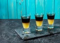 Black Shooter - Black Balsam and peach juice. Hard alcoholic shots on stone table