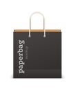 Black shopping bag. Square paper sack, mockup for branding. Blank packaging for purchases. Cardboard package with rope handles and