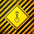 Black Shovel toy icon isolated on yellow background. Warning sign. Vector