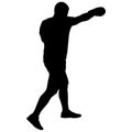 Black silhouette of an athlete boxer on a white background