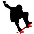 Black silhouette of an athlete skateboarder in a jump