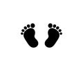 Black silhouette of baby footprints isolated on white background Royalty Free Stock Photo
