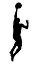 Black silhouette of a basketball player who jumps high to shoot the ball into the hoop Royalty Free Stock Photo