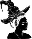 black silhouette of beautiful witch in a classic hat Royalty Free Stock Photo