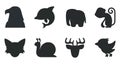 Black silhouette collection of eagle, dolphin, elephant, monkey, wolf, snail, deer and bird.