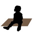 Black silhouette of cute toddler sitting on floor, front view, vector isolated on white background