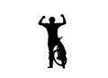 Black silhouette of cyclist raising his hands in triumph and rejoicing in victory. Male bicyclist riding sports bike on Royalty Free Stock Photo