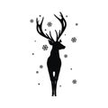 Black silhouette of an elegant deer in front of a snowflakes