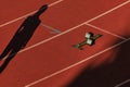 black silhouette female athlete on red track stadium Royalty Free Stock Photo