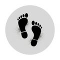 Black Silhouette Footprints with Spray Paint Effect on Light Gray Circular Background step Royalty Free Stock Photo