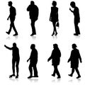 Black silhouette group of people standing in various poses Royalty Free Stock Photo