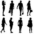 Black silhouette group of people standing in various poses Royalty Free Stock Photo