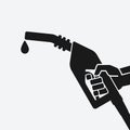 Black silhouette hand with gasoline fuel nozzle Royalty Free Stock Photo