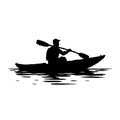 black silhouette of a Kayaker paddling in a river