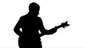 Black silhouette of a man playing the guitar on a white background Royalty Free Stock Photo